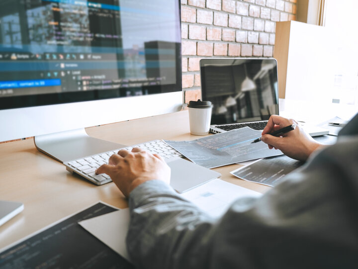 a person at a computer editing content